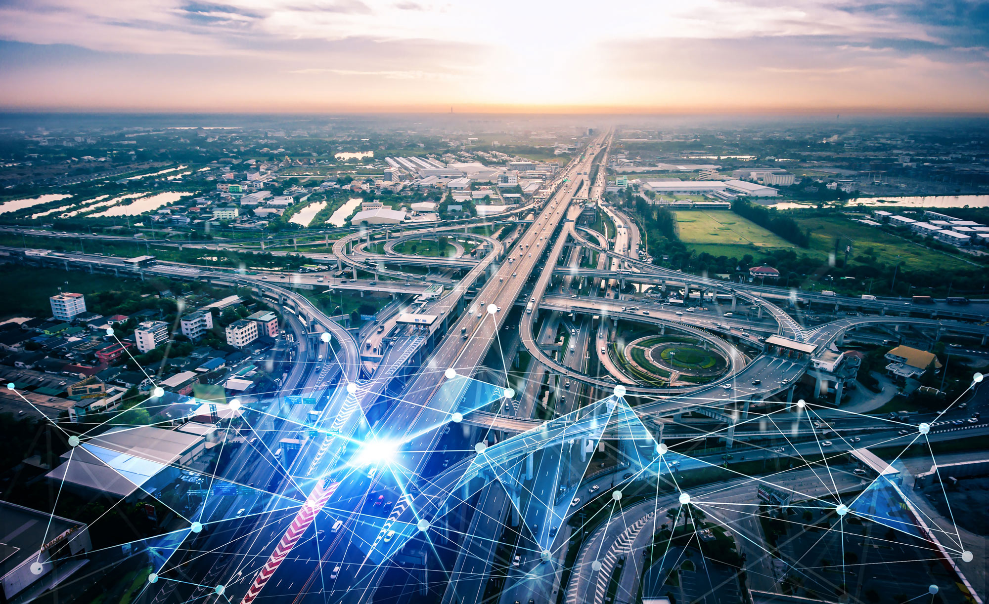 Aerial view of traffic moving through a connected highway interchange